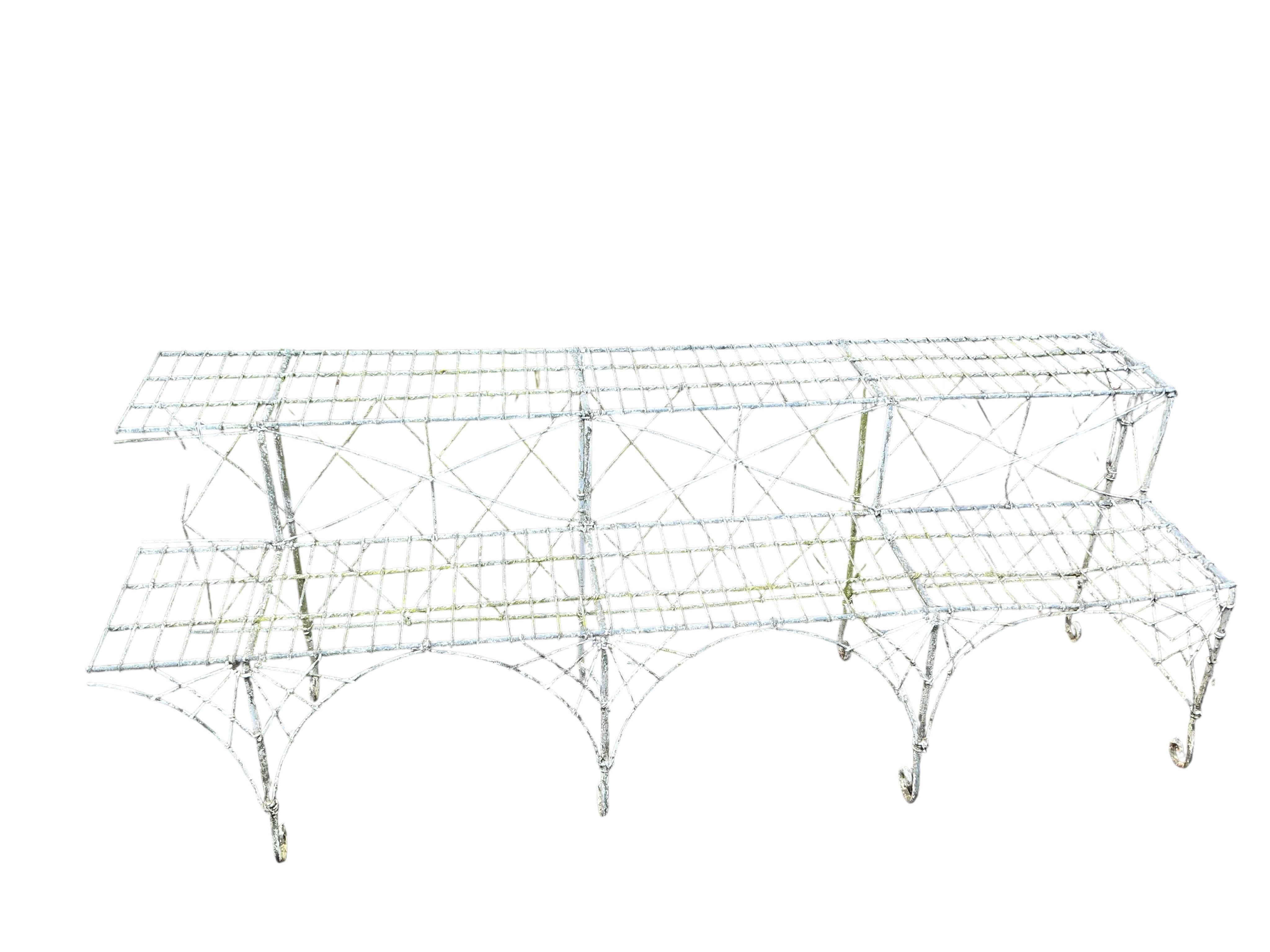 A Victorian painted wire work two tier pot stand, width 180cm, height 63cm